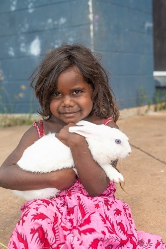 Aboriginal child with pet rabbit
