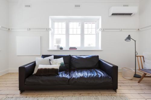 Blank white framed art in contemporary interior styled living room