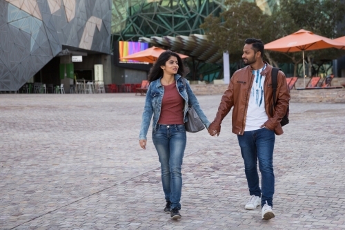 Couple Walking in Federation Square