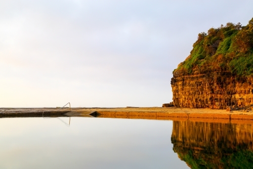 Early morning reflections in the Wombarra Rock Pool on the Illawarra Coast