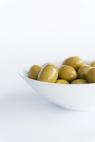Green Olives In A Bowl on White