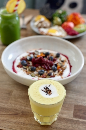 Healthy porridge served with hot beverage in vegetarian cafe