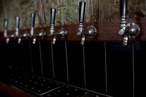Row of beer taps at craft beer pub