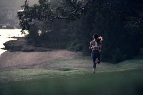 Runner running through a park for morning exercise