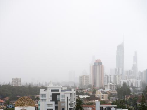Tall Gold Coast buildings in misty rain