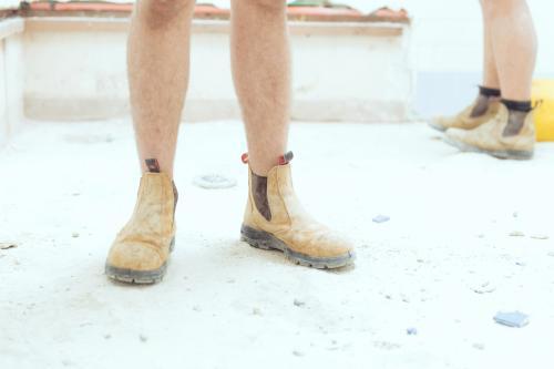 Tradesman wearing boots on construction site