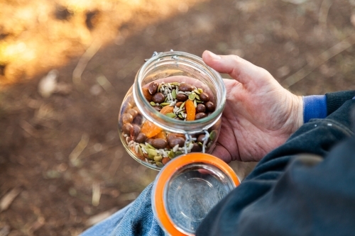 Trail mix snack in a jar at picnic