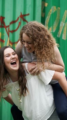Two teenage girls laughing