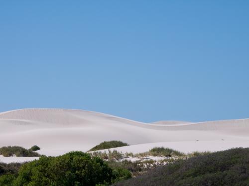 White sand dune with a big clear blue sky
