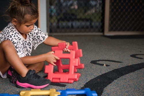 Young Aboriginal girl playing at preschool