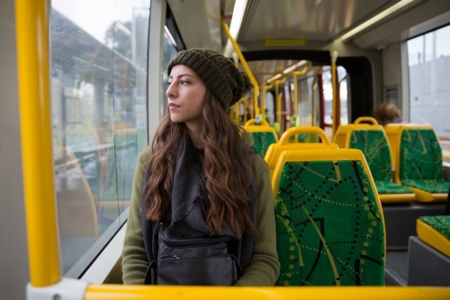 Young Woman Sits Alone on the Melbourne Tram