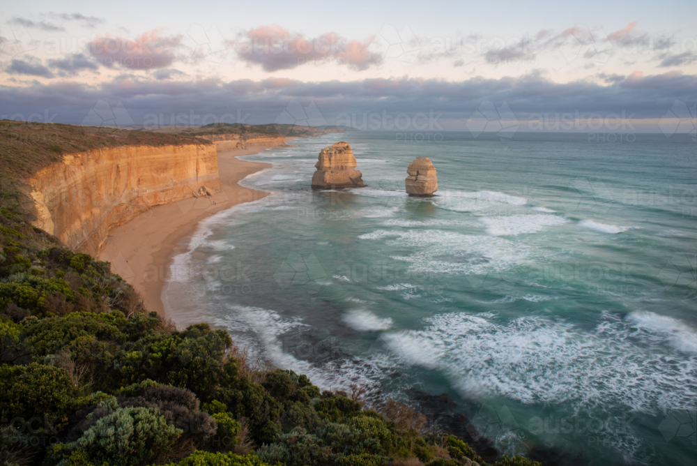 12 Apostles and Gibson Beach on the Port Campbell coast at sunset - Australian Stock Image