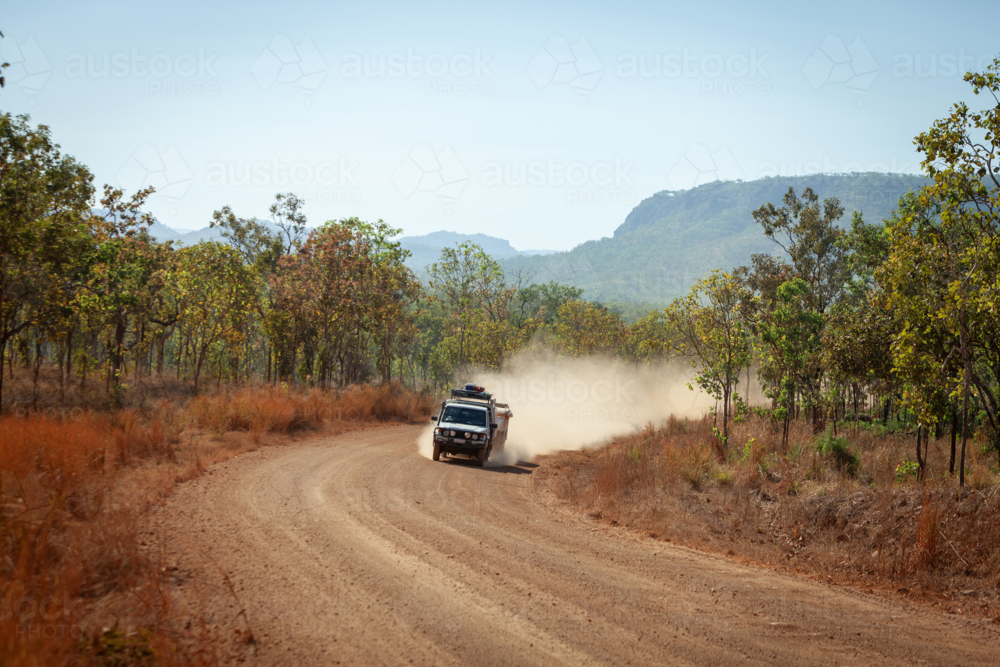 4 x 4 driving on dusty gravel road - Australian Stock Image