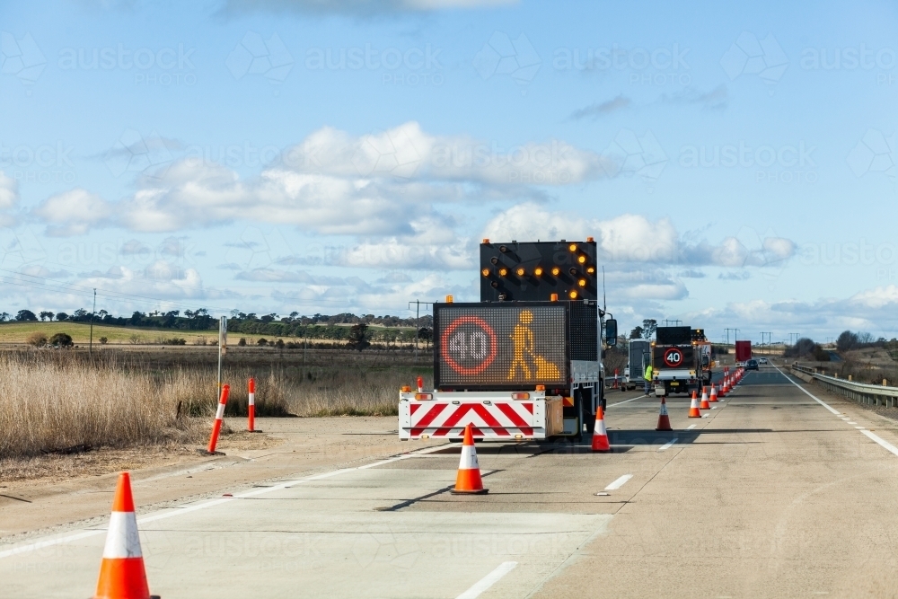 40 roadwork sign on side of highway with road cones - Australian Stock Image