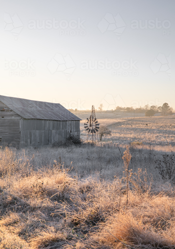 A broken windmill, an old shed and a winter's morning - Australian Stock Image