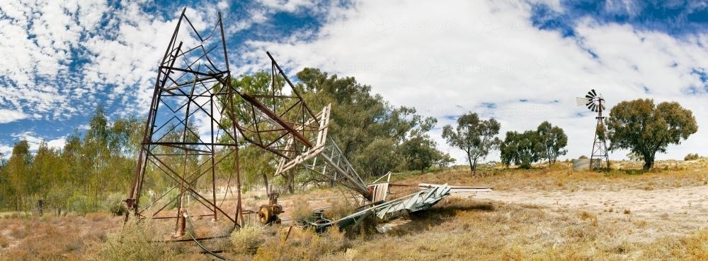 A broken windmill lying on the ground - Australian Stock Image