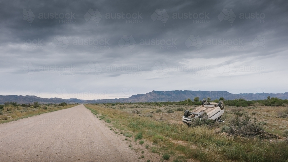 A car rolled over after having an accident on a rural road - Australian Stock Image