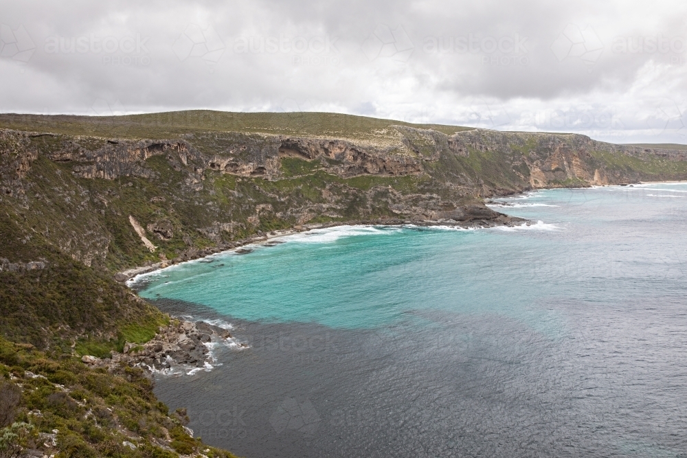 A coastal cliff overlooking the turquoise water - Australian Stock Image