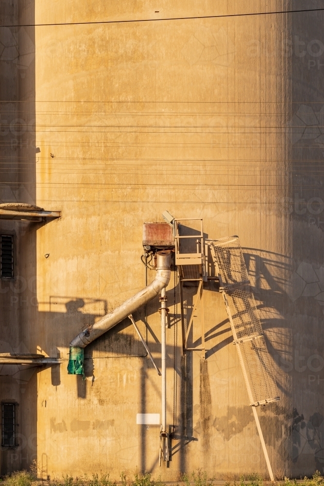 A grain loading chute  on the side of a concrete silo - Australian Stock Image