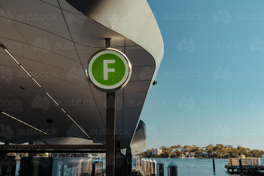A green ferry wayfinding sign at Barangaroo Wharf, NSW - Australian Stock Image