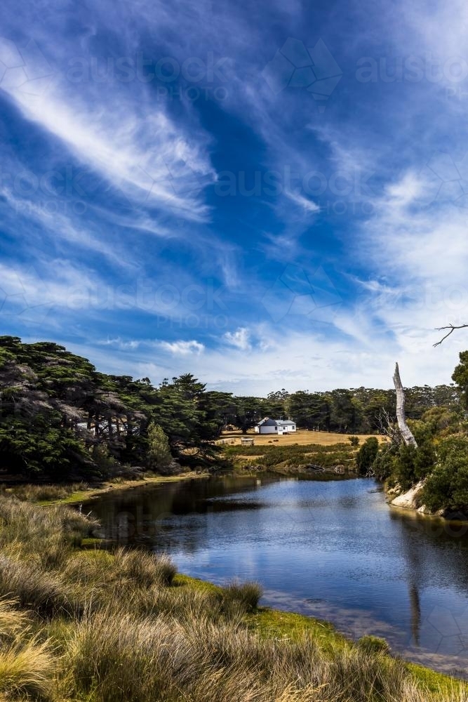 A house on the river's edge on Maria Island. - Australian Stock Image