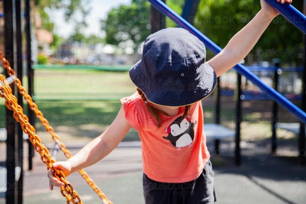 A kid playing at the playground - Australian Stock Image