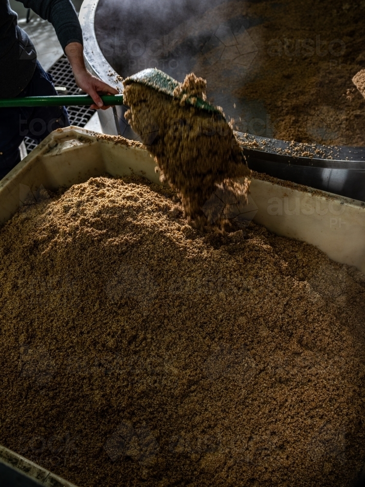 A large container being filled with grain - Australian Stock Image