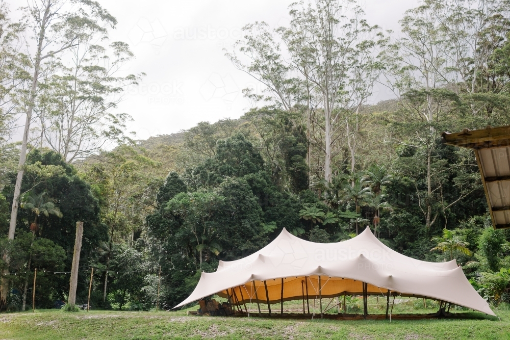 A large white tent in the forest. - Australian Stock Image