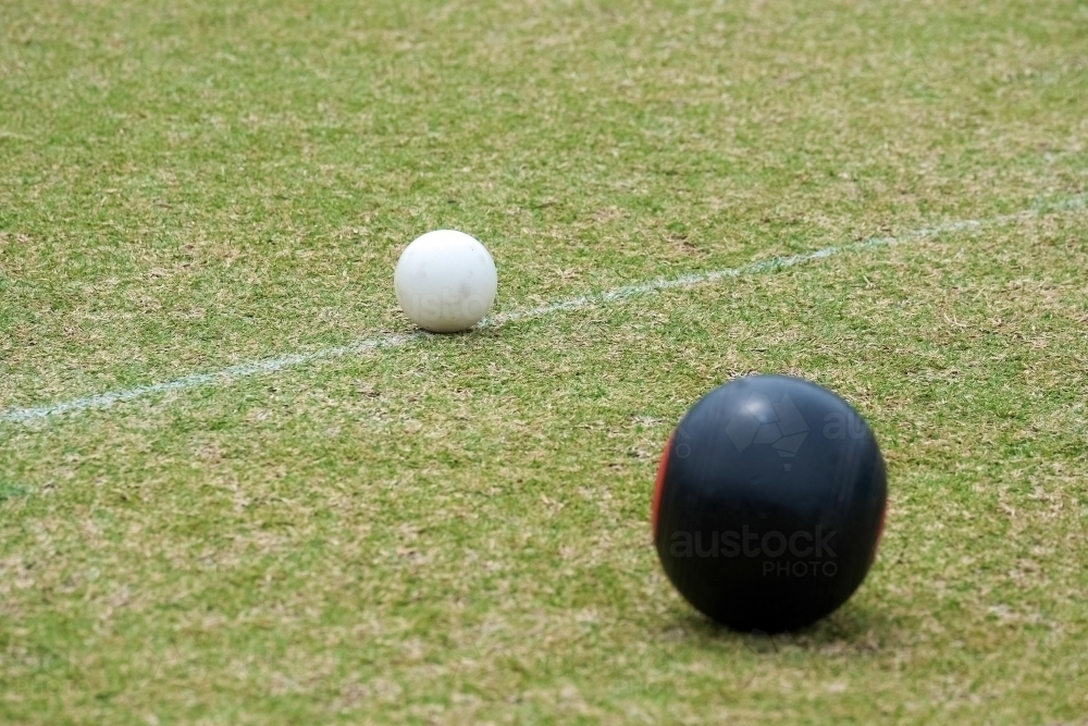 a lawnball wood next to a jack - Australian Stock Image