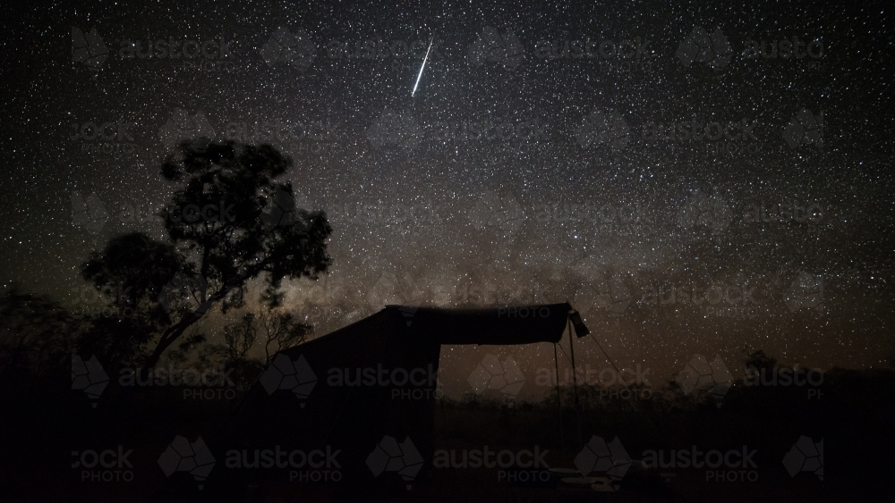 A night sky filled with stars and meteor streak. - Australian Stock Image