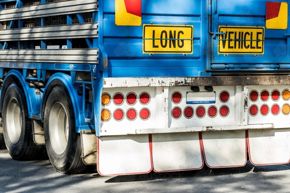 A sign reading 'Long Vehicle' on the back of a semi trailer road train used to transport animals - Australian Stock Image