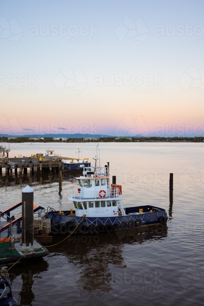 A tug boat on the Brisbane River at the Port of Brisbane - Australian Stock Image