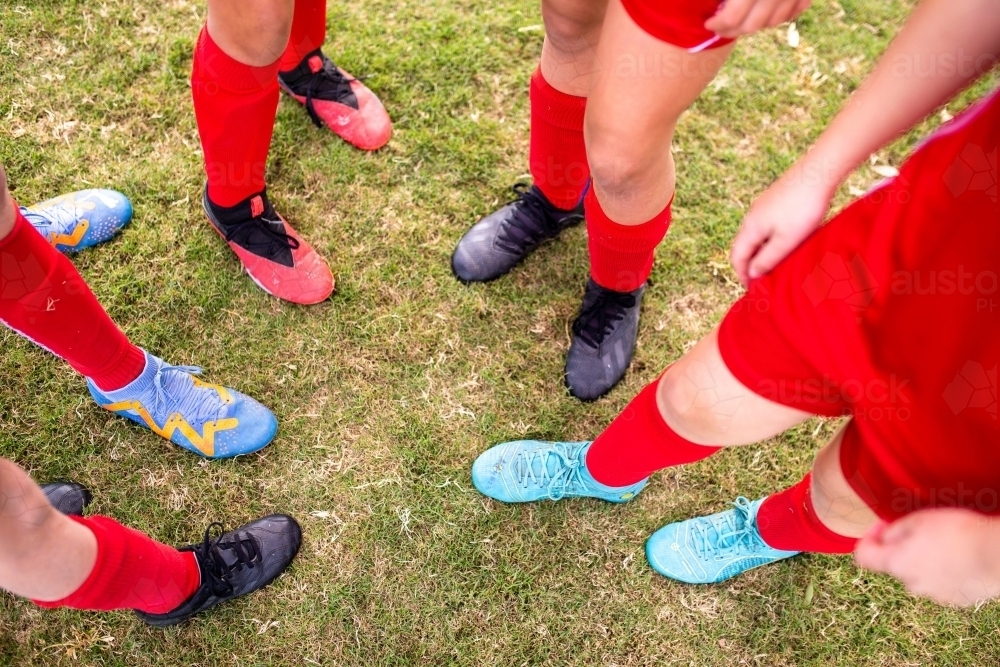 A tween girls football team's feet and legs - Australian Stock Image