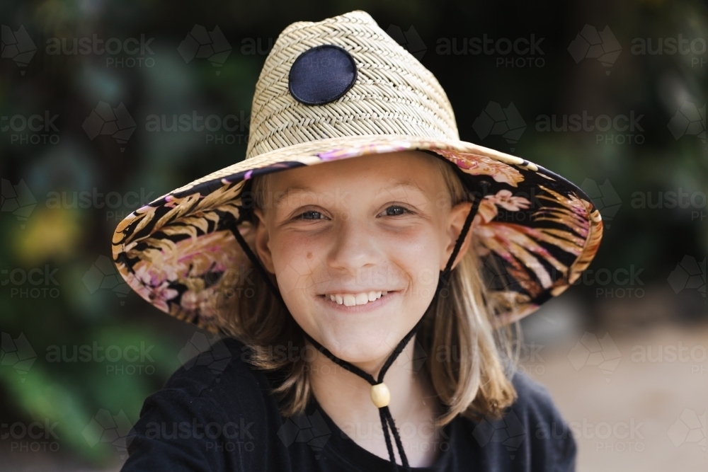 A young australian 11 year old girl wearing a sun smart wide brimmed hat - Australian Stock Image