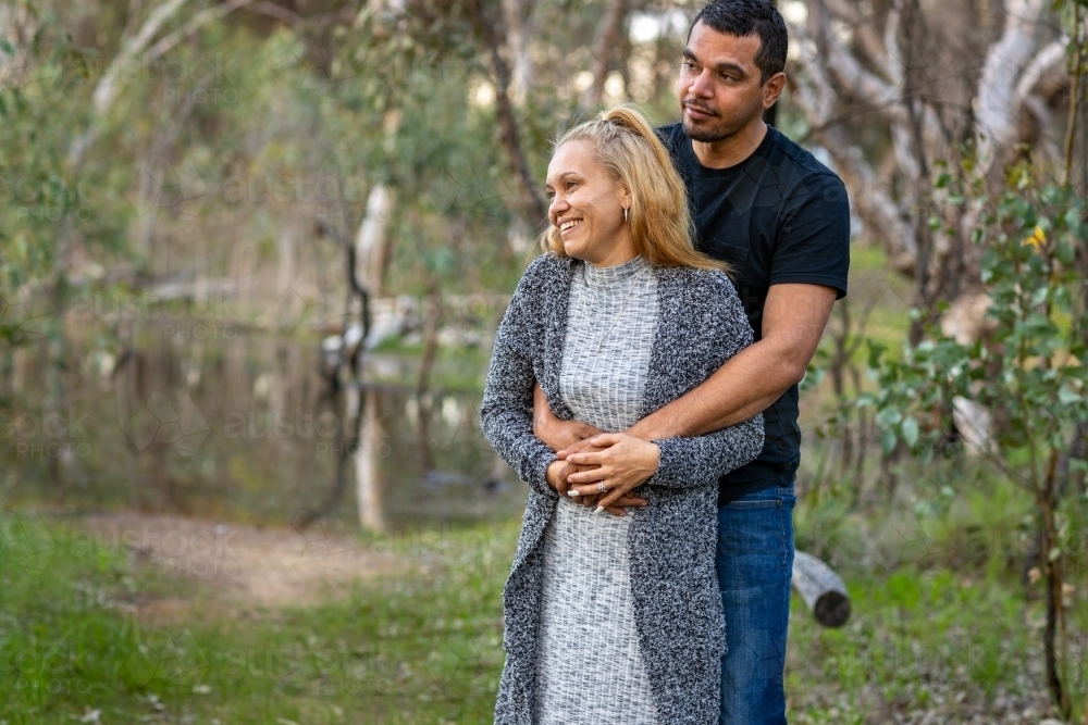 aboriginal couple in bushland setting - Australian Stock Image