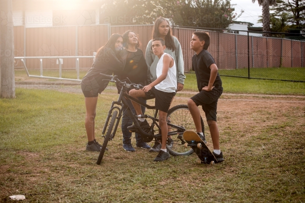 Aboriginal family in backyard - Australian Stock Image