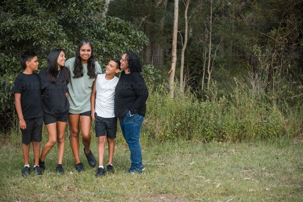 Aboriginal family portrait outdoors - Australian Stock Image