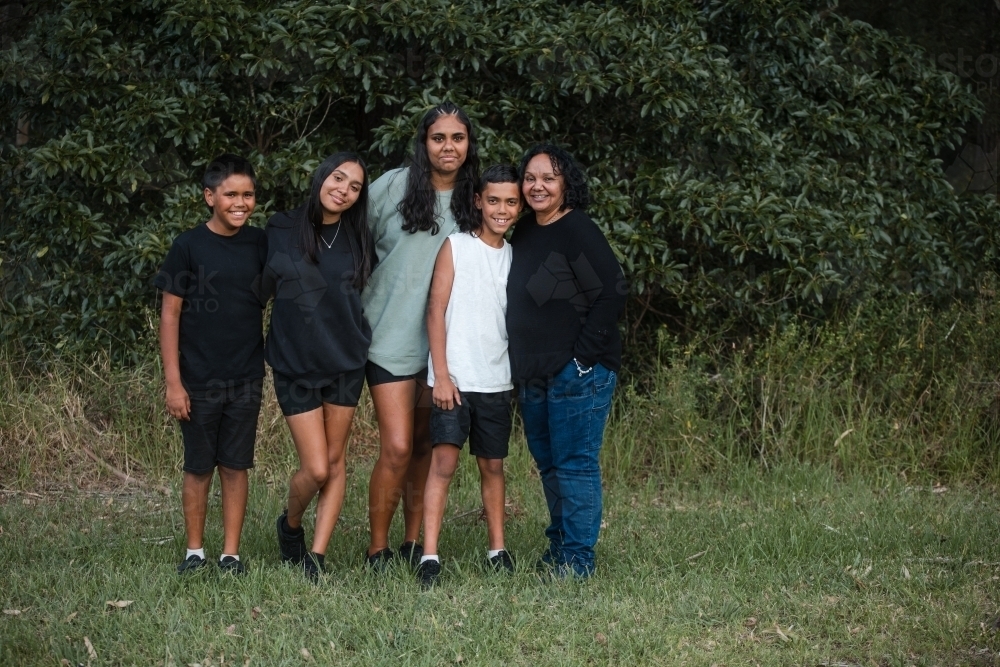 Aboriginal family portrait outdoors - Australian Stock Image