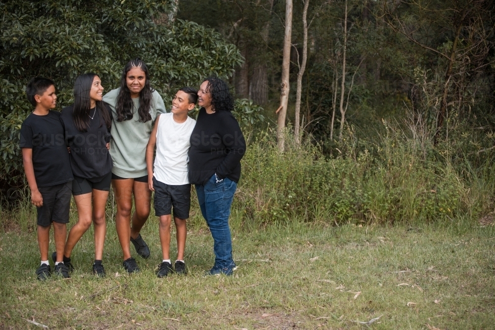 Aboriginal family portrait outdoors - Australian Stock Image