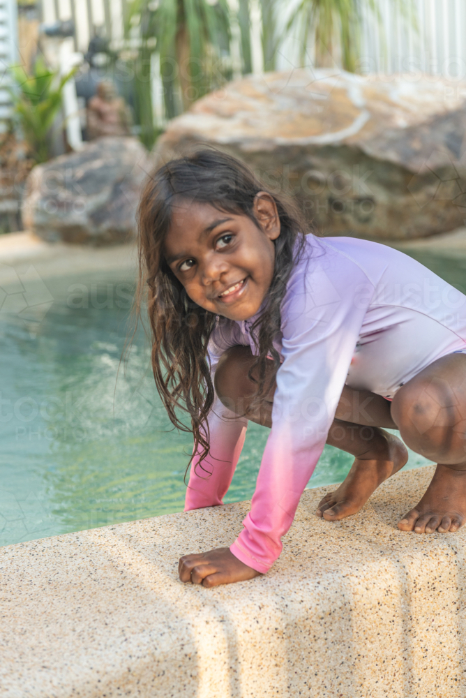 Aboriginal girl near pool - Australian Stock Image