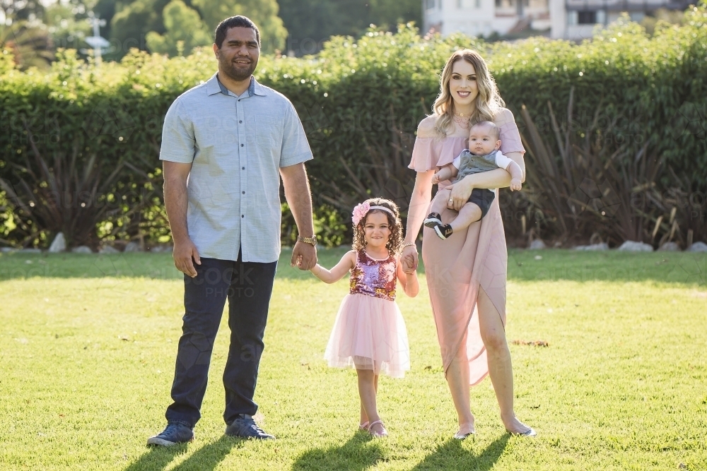 Aboriginal man Caucasian woman with children - Australian Stock Image