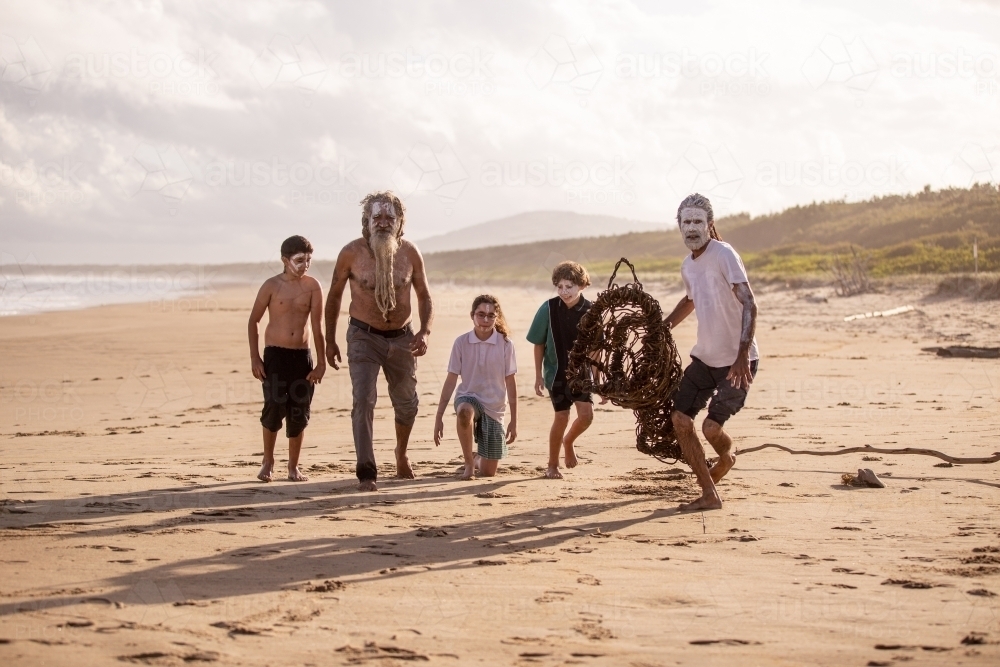 Aboriginal mob at the beach looking at camera - Australian Stock Image