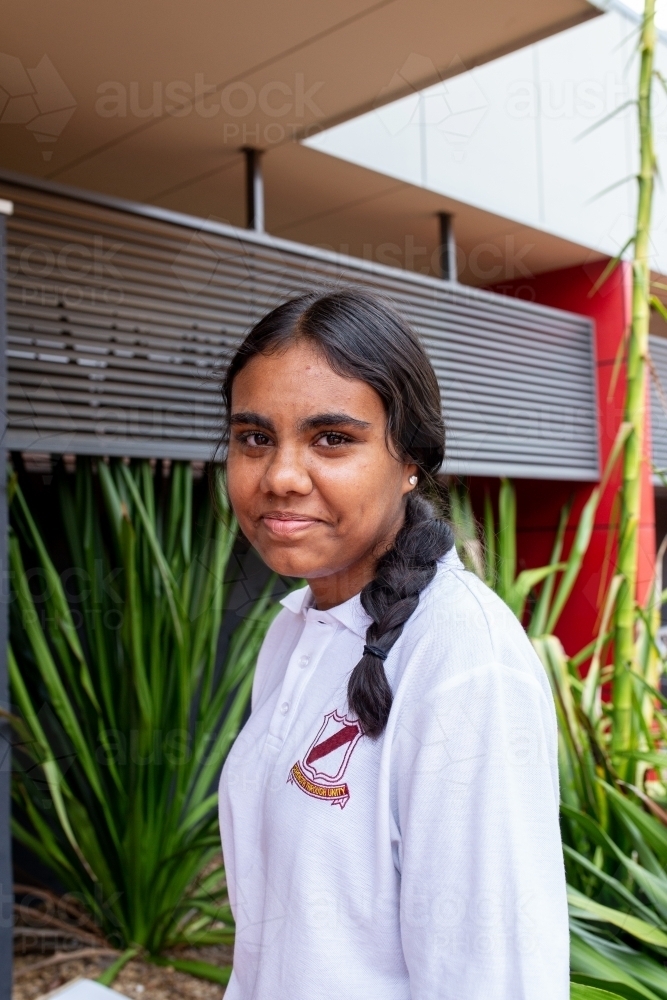 Aboriginal teenage school student looking at the camera - Australian Stock Image