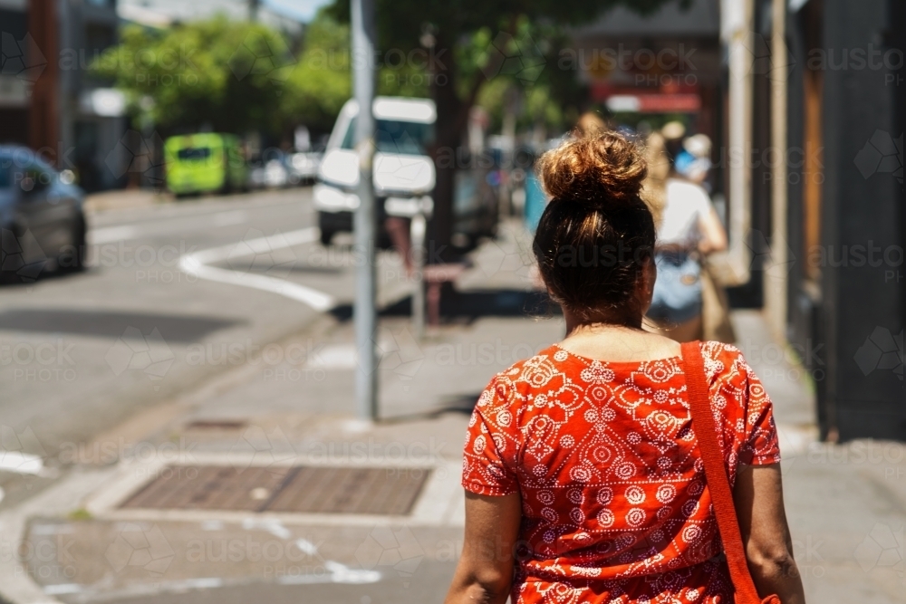 aboriginal woman crossing the road - Australian Stock Image