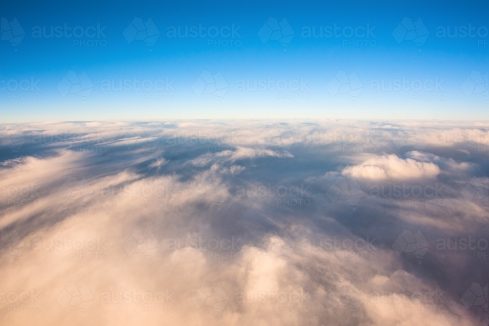 Above the clouds in a plane - Australian Stock Image