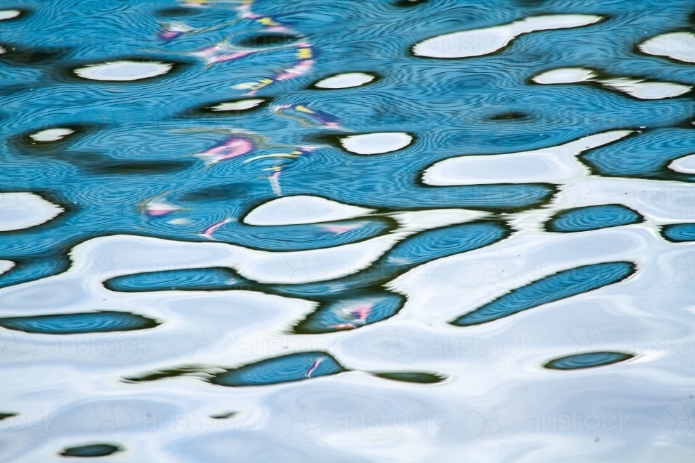 Image of Abstract blue water reflection patterns. - Austockphoto