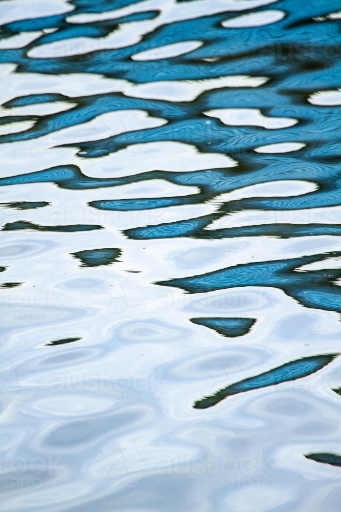 Image of Abstract blue water reflection patterns. - Austockphoto