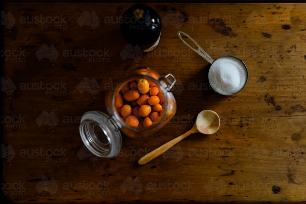 Aeria shot of Kumquats in bottling jar - Australian Stock Image