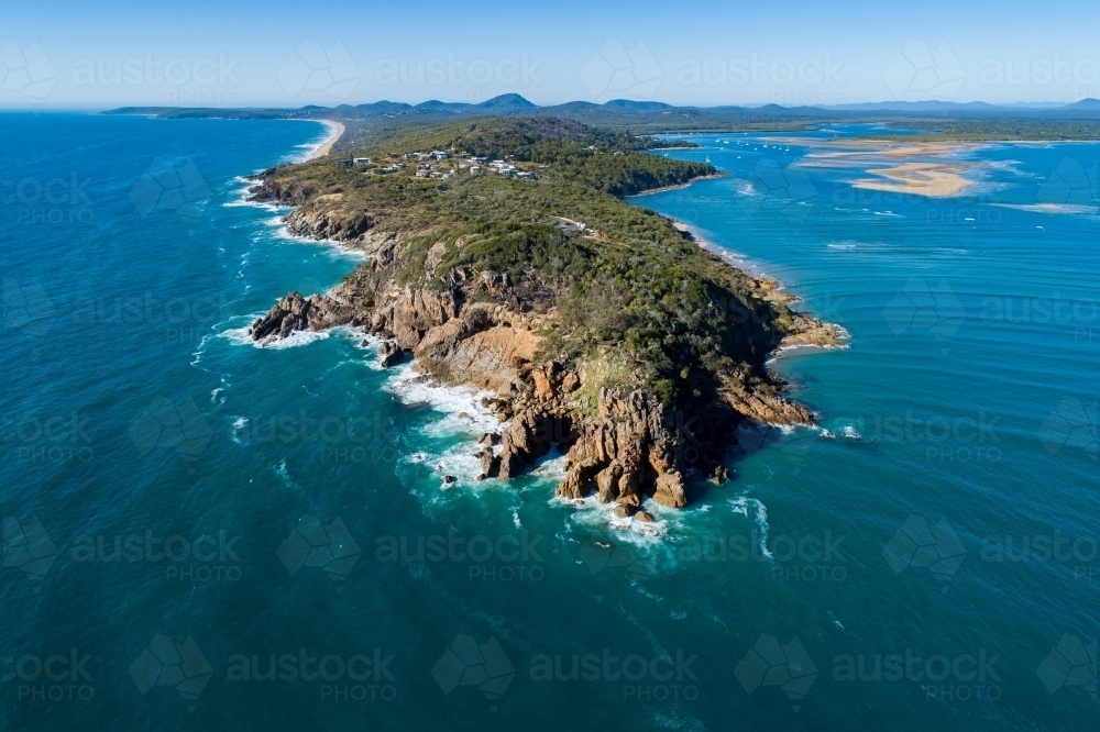 Aerial image of Round Hill headland and the Town of 1770, Round Hill Creek, and Agnes Water. - Australian Stock Image