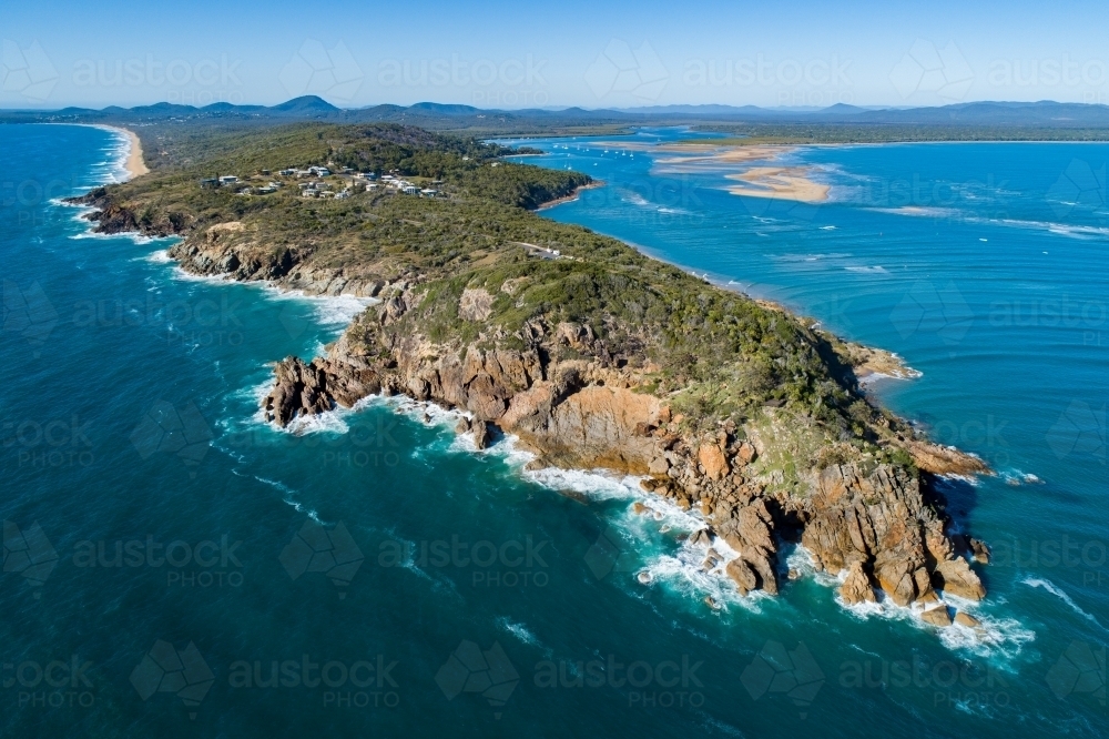 Aerial image of Round Hill headland, Bustard Bay, Round Hill Creek, and the Town of 1770, QLD. - Australian Stock Image